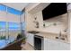Lanai with wet bar, mini fridge, television, and amazing views at 95 N Marion Ct # 226, Punta Gorda, FL 33950