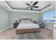 The main bedroom features a ceiling fan and a water view at 95 N Marion Ct # 226, Punta Gorda, FL 33950