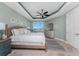 Bright main bedroom features a ceiling fan and view from the window at 95 N Marion Ct # 226, Punta Gorda, FL 33950