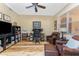 Well-lit home office with hardwood floors, comfortable seating, and functional layout at 95 N Marion Ct # 226, Punta Gorda, FL 33950