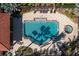 A bird's eye view shows a lovely pool area with a jacuzzi and some lounge chairs for residents to relax at 95 N Marion Ct # 226, Punta Gorda, FL 33950