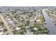 Neighborhood aerial showing homes along canals with boat access and community layout at 103 Curtis Ne Ter, Port Charlotte, FL 33952