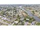 Aerial showcases waterfront community with houses, canals, and boating access at 103 Curtis Ne Ter, Port Charlotte, FL 33952