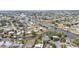 Expansive aerial view of canal-front homes in a vibrant coastal community, with lush greenery at 103 Curtis Ne Ter, Port Charlotte, FL 33952