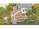 Waterfront home featuring a private dock, garden area, and backyard retreat at 103 Curtis Ne Ter, Port Charlotte, FL 33952