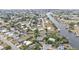 Community aerial displays waterways, homes with boat docks, and residential streets at 103 Curtis Ne Ter, Port Charlotte, FL 33952