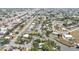 Real estate aerial featuring waterfront homes with canal access and neighborhood streets at 103 Curtis Ne Ter, Port Charlotte, FL 33952