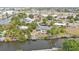 Waterfront home features mature landscaping, a private dock, and easy access to canals at 103 Curtis Ne Ter, Port Charlotte, FL 33952