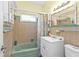 Cozy bathroom with a tub, large mirror, and vanity offering a functional space at 103 Curtis Ne Ter, Port Charlotte, FL 33952