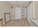 Bright bedroom with wood-look floors and closet providing ample storage at 103 Curtis Ne Ter, Port Charlotte, FL 33952