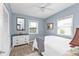 Serene bedroom with a ceiling fan, natural light, and neutral color palette at 103 Curtis Ne Ter, Port Charlotte, FL 33952