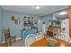 Charming dining area with blue walls and rustic decor, creating a warm and inviting atmosphere at 103 Curtis Ne Ter, Port Charlotte, FL 33952