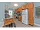 Functional kitchen featuring ample wood cabinets, stainless steel appliances and breakfast bar at 103 Curtis Ne Ter, Port Charlotte, FL 33952