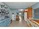 Cozy kitchen featuring a breakfast bar, tiled floors, and ample cabinet space at 103 Curtis Ne Ter, Port Charlotte, FL 33952