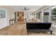 Spacious living room with wood-look flooring, a built-in display cabinet, and ample seating at 103 Curtis Ne Ter, Port Charlotte, FL 33952