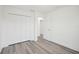 Bright bedroom with ample closet space and wood-look flooring at 11456 5Th Ave, Punta Gorda, FL 33955