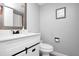 Well-lit bathroom with a large mirror, vanity, and tiled floors for easy maintenance at 1211 Saxony Cir # B5, Punta Gorda, FL 33983