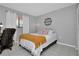 Simply decorated bedroom with white walls, a single window, and a cozy atmosphere at 1211 Saxony Cir # B5, Punta Gorda, FL 33983