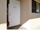 A front door with a light shining on it and the unit number B5 at 1211 Saxony Cir # B5, Punta Gorda, FL 33983