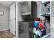 Efficient laundry space with modern stacked washer and dryer, maximizing utility and convenience at 1211 Saxony Cir # B5, Punta Gorda, FL 33983