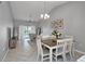 Open-concept living and dining room featuring tile floors and a sliding glass door to the outside at 1211 Saxony Cir # B5, Punta Gorda, FL 33983