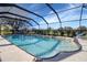 Screened-in swimming pool area offering a refreshing escape with clear water and surrounding greenery at 1211 Saxony Cir # B5, Punta Gorda, FL 33983