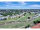 Aerial view highlighting the community bordering a golf course with winding waterways at 1235 Saxony Cir # 5202, Punta Gorda, FL 33983