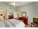 Large bedroom with ceiling fan, ensuite bathroom, and plenty of natural light at 1235 Saxony Cir # 5202, Punta Gorda, FL 33983
