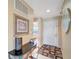Bright entryway with table, neutral walls, and decorative mirror at 1235 Saxony Cir # 5202, Punta Gorda, FL 33983