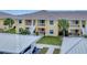 Bright condo complex featuring lush landscaping, covered parking, and easy access to units at 1235 Saxony Cir # 5202, Punta Gorda, FL 33983