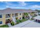 Beautiful aerial view of the condo complex with well-maintained landscaping and ample parking at 1235 Saxony Cir # 5202, Punta Gorda, FL 33983