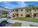 Two-story condo building with mature landscaping and covered parking at 1235 Saxony Cir # 5202, Punta Gorda, FL 33983