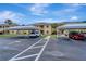 Exterior of property with assigned covered parking; well-maintained and landscaped grounds add to the property's curb appeal at 1235 Saxony Cir # 5202, Punta Gorda, FL 33983