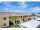 Scenic aerial view of the condo complex with lush landscaping and covered parking at 1235 Saxony Cir # 5202, Punta Gorda, FL 33983