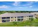 Aerial view of the condo complex showing screened lanais and well-maintained lawns at 1235 Saxony Cir # 5202, Punta Gorda, FL 33983