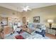 Bright living room with vaulted ceiling, ceiling fan, hardwood floors, and comfortable furnishings at 1235 Saxony Cir # 5202, Punta Gorda, FL 33983