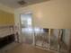View of kitchen looking out at gutted walls and missing flooring into other rooms at 134 Peace Island Dr, Punta Gorda, FL 33950