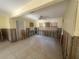 Well-lit room offering refurbishment possibilities with tiled floors, a ceiling fan, and bright windows at 134 Peace Island Dr, Punta Gorda, FL 33950