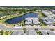 Beautiful aerial view of townhomes and a lake in a lush community with a golf course at 14617 Sycamore Ct # 2211, Punta Gorda, FL 33955