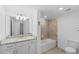 Bathroom featuring granite countertop, tub, and a 'Be Amazing Today' sign at 14617 Sycamore Ct # 2211, Punta Gorda, FL 33955