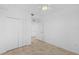 Spacious bedroom featuring a ceiling fan, closet, and tile flooring at 14617 Sycamore Ct # 2211, Punta Gorda, FL 33955