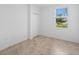 Bedroom with a closet and a window offering a view of the outside scenery at 14617 Sycamore Ct # 2211, Punta Gorda, FL 33955
