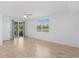 Bright bedroom with tile flooring, ceiling fan, and large window overlooking the water at 14617 Sycamore Ct # 2211, Punta Gorda, FL 33955