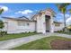 A well-kept, bright clubhouse exterior with manicured landscaping and a stylish entrance at 14617 Sycamore Ct # 2211, Punta Gorda, FL 33955
