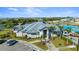 Community clubhouse featuring manicured landscaping, a pool and parking at 14617 Sycamore Ct # 2211, Punta Gorda, FL 33955
