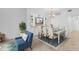 Bright dining room with elegant chandelier, built-in display cabinets, and seating for six at 14617 Sycamore Ct # 2211, Punta Gorda, FL 33955