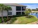 Beautiful lake view with screened in porch and tropical landscaping at 14617 Sycamore Ct # 2211, Punta Gorda, FL 33955