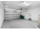 Spacious garage with ample storage, shelving, and an automatic door opener at 14617 Sycamore Ct # 2211, Punta Gorda, FL 33955
