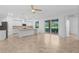 Open floor plan featuring a kitchen with granite counters and a breakfast bar with pendant lighting at 14617 Sycamore Ct # 2211, Punta Gorda, FL 33955