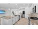 Bright kitchen with stainless steel appliances, granite countertops, and a large island with dual sinks at 14617 Sycamore Ct # 2211, Punta Gorda, FL 33955